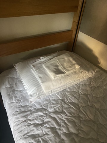 Mesa Court accommodations: Bed with fresh linens
